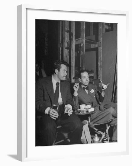 Orson Welles and Cole Porter Discussing the Stage Production of "Around the World in 80 Days"-Al Fenn-Framed Premium Photographic Print