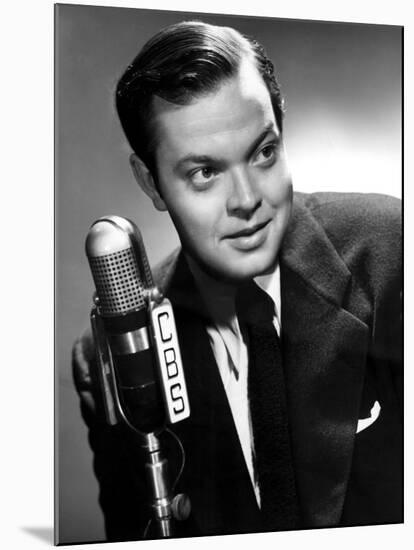 Orson Welles at the CBS Microphone in Publicity Shot for Murcury Summer Theater, 1946-null-Mounted Photo