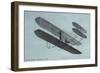 Orville Wright in Biplane-null-Framed Art Print