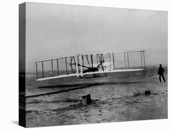 Orville Wright Taking Plane For 1st Motorized Flight as Brother Wilbur Wright Looks at Kitty Hawk-null-Stretched Canvas