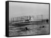 Orville Wright Taking Plane For 1st Motorized Flight as Brother Wilbur Wright Looks at Kitty Hawk-null-Framed Stretched Canvas