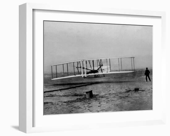 Orville Wright Taking Plane For 1st Motorized Flight as Brother Wilbur Wright Looks at Kitty Hawk-null-Framed Photographic Print