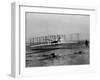 Orville Wright Taking Plane For 1st Motorized Flight as Brother Wilbur Wright Looks at Kitty Hawk-null-Framed Photographic Print