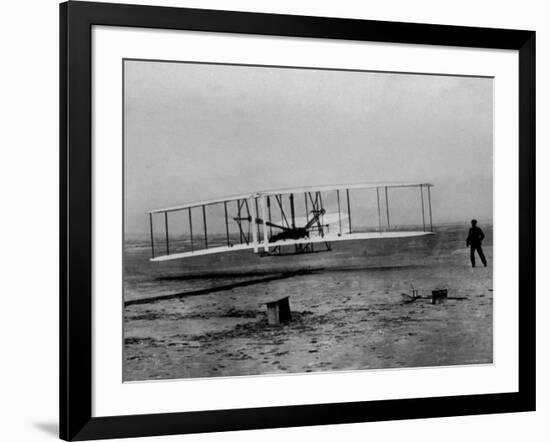 Orville Wright Taking Plane For 1st Motorized Flight as Brother Wilbur Wright Looks at Kitty Hawk-null-Framed Photographic Print