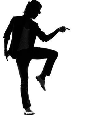 full length silhouette of a young man dancer dancing funky hip hop r and bostill