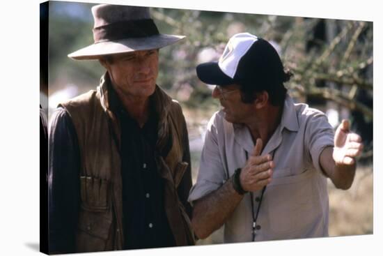 OUT OF AFRICA, 1985 directed by SYDNEY POLLACK On the set, Sydney Pollack directs Rober Redford (ph-null-Stretched Canvas