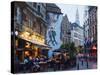 Outdoor Cafes and Brousaille Wall Mural of a Couple Walking Arm in Arm, Brussels, Belgium, Europe-Christian Kober-Stretched Canvas