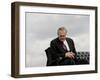 Outgoing Secretary of Defense Donald Rumsfeld Looks Down as He Sits on Stage-Pablo Martinez Monsivais-Framed Photographic Print