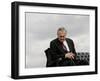 Outgoing Secretary of Defense Donald Rumsfeld Looks Down as He Sits on Stage-Pablo Martinez Monsivais-Framed Photographic Print