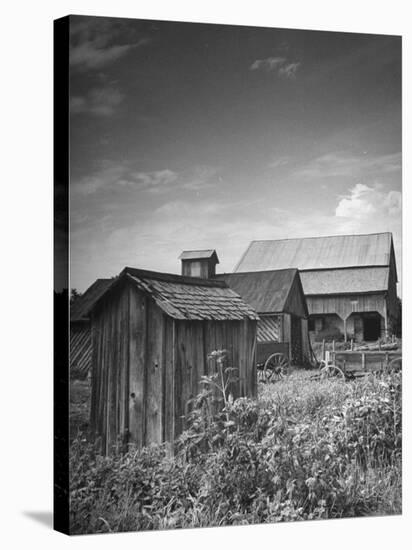 Outhouse Sitting Behind the Barn on a Farm-Bob Landry-Stretched Canvas