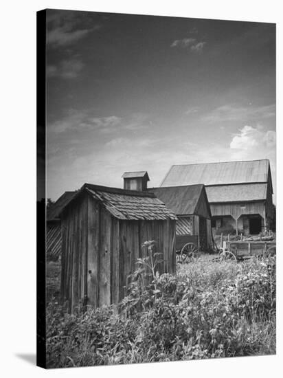 Outhouse Sitting Behind the Barn on a Farm-Bob Landry-Stretched Canvas