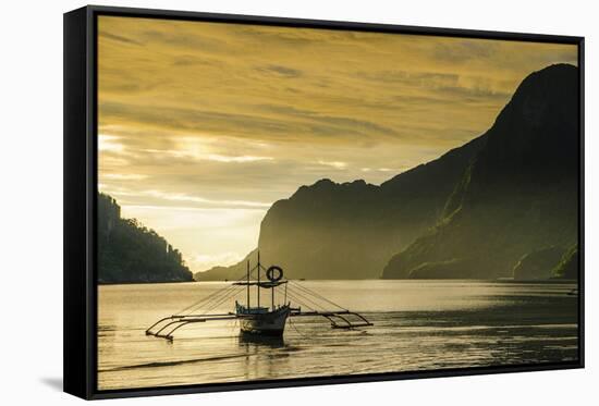 Outrigger at Sunset in the Bay of El Nido, Bacuit Archipelago, Palawan, Philippines-Michael Runkel-Framed Stretched Canvas