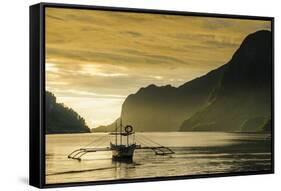 Outrigger at Sunset in the Bay of El Nido, Bacuit Archipelago, Palawan, Philippines-Michael Runkel-Framed Stretched Canvas