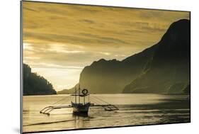 Outrigger at Sunset in the Bay of El Nido, Bacuit Archipelago, Palawan, Philippines-Michael Runkel-Mounted Photographic Print