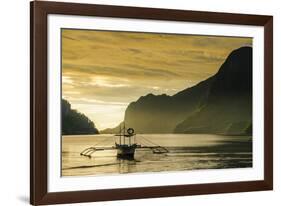 Outrigger at Sunset in the Bay of El Nido, Bacuit Archipelago, Palawan, Philippines-Michael Runkel-Framed Photographic Print