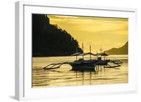 Outrigger at Sunset in the Bay of El Nido, Bacuit Archipelago, Palawan, Philippines-Michael Runkel-Framed Photographic Print