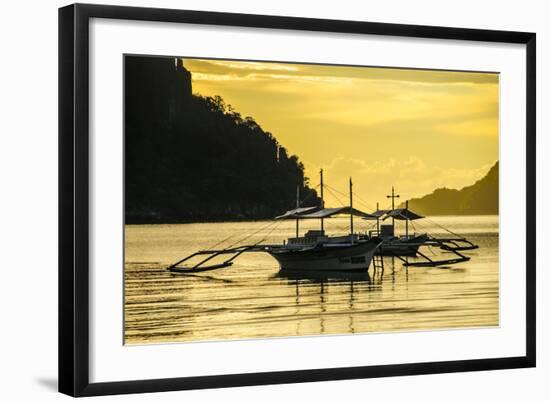 Outrigger at Sunset in the Bay of El Nido, Bacuit Archipelago, Palawan, Philippines-Michael Runkel-Framed Photographic Print