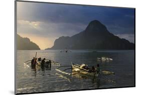 Outrigger Boat at Sunset in the Bay of El Nido, Bacuit Archipelago, Palawan, Philippines-Michael Runkel-Mounted Photographic Print