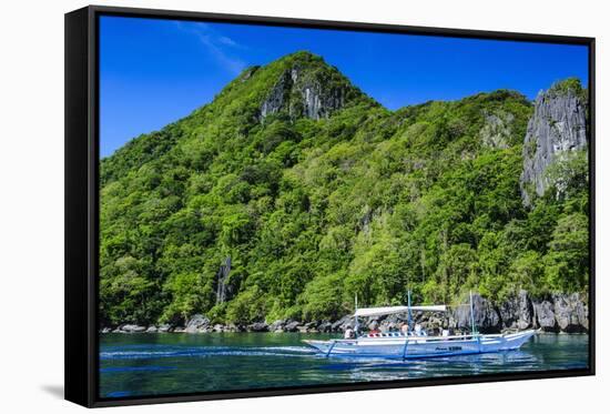 Outrigger Boat Cruising in the Bay of El Nido, Bacuit Archipelago, Palawan, Philippines-Michael Runkel-Framed Stretched Canvas