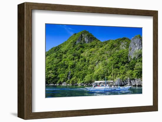 Outrigger Boat Cruising in the Bay of El Nido, Bacuit Archipelago, Palawan, Philippines-Michael Runkel-Framed Photographic Print