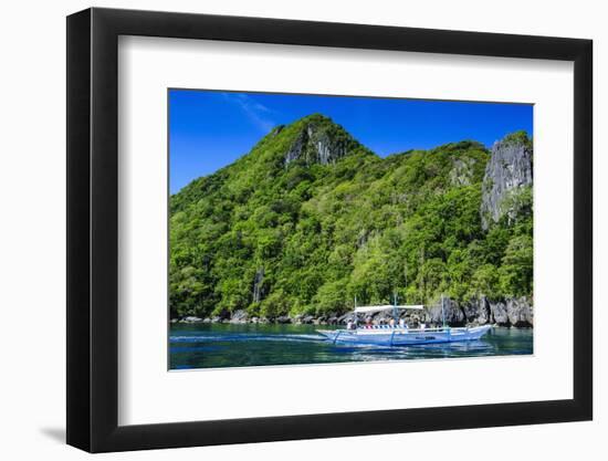 Outrigger Boat Cruising in the Bay of El Nido, Bacuit Archipelago, Palawan, Philippines-Michael Runkel-Framed Photographic Print