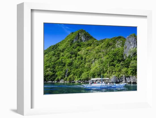 Outrigger Boat Cruising in the Bay of El Nido, Bacuit Archipelago, Palawan, Philippines-Michael Runkel-Framed Photographic Print