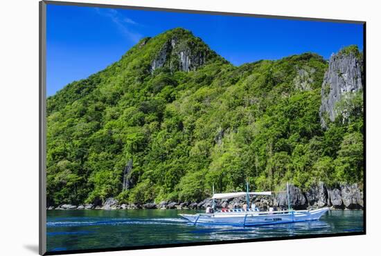 Outrigger Boat Cruising in the Bay of El Nido, Bacuit Archipelago, Palawan, Philippines-Michael Runkel-Mounted Photographic Print