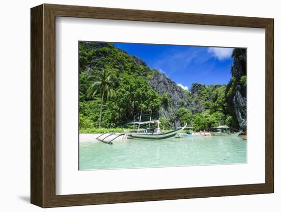 Outrigger Boat in the Crystal Clear Water in the Bacuit Archipelago, Palawan, Philippines-Michael Runkel-Framed Photographic Print