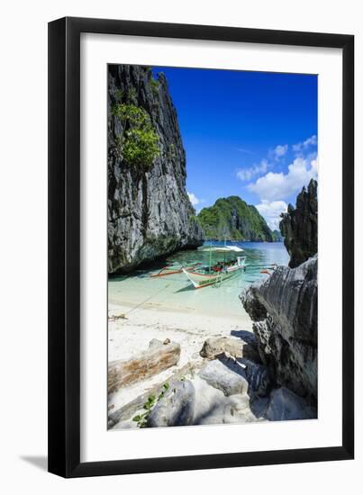 Outrigger Boat on a Little White Beach and Crystal Clear Water in the Bacuit Archipelago-Michael Runkel-Framed Photographic Print