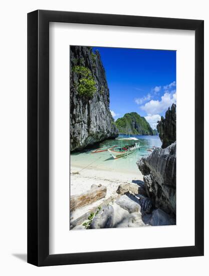 Outrigger Boat on a Little White Beach and Crystal Clear Water in the Bacuit Archipelago-Michael Runkel-Framed Photographic Print