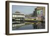 Overground train drives past canal by artists studios and warehouses in Hackney Wick, London, Engla-Julio Etchart-Framed Photographic Print