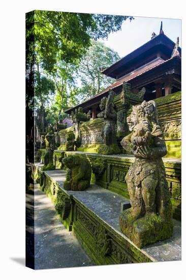Overgrown Statues in a Temple in the Monkey Forest, Ubud, Bali, Indonesia, Southeast Asia, Asia-Michael Runkel-Stretched Canvas