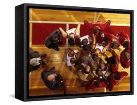 Overhead View of Coach Instructing High School Basketball Team-null-Framed Stretched Canvas