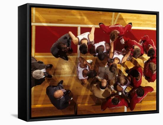 Overhead View of Coach Instructing High School Basketball Team-null-Framed Stretched Canvas