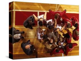 Overhead View of Coach Instructing High School Basketball Team-null-Stretched Canvas