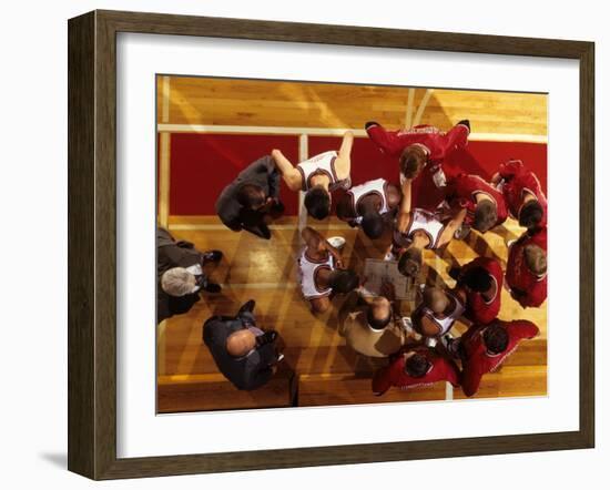 Overhead View of Coach Instructing High School Basketball Team-null-Framed Photographic Print