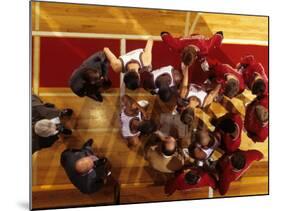 Overhead View of Coach Instructing High School Basketball Team-null-Mounted Photographic Print