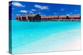 Overwater Villas in Blue Tropical Lagoon with White Sandy Beach-Martin Valigursky-Stretched Canvas