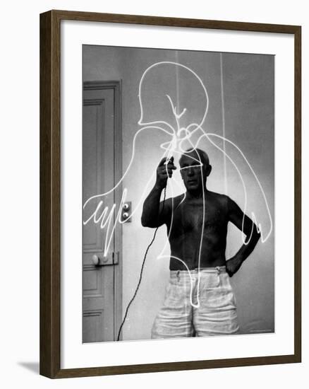 Pablo Picasso Using Flashlight to Make Light Drawing in the Air-Gjon Mili-Framed Premium Photographic Print