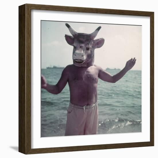 Pablo Picasso Wearing a Cow's Head Mask on Beach at Golfe Juan Near Vallauris-Gjon Mili-Framed Premium Photographic Print