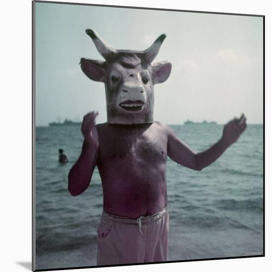 Pablo Picasso Wearing a Cow's Head Mask on Beach at Golfe Juan Near Vallauris-Gjon Mili-Mounted Premium Photographic Print