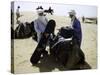 Packing up a Camel, Morocco-Michael Brown-Stretched Canvas