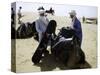 Packing up a Camel, Morocco-Michael Brown-Stretched Canvas