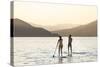 Paddleboarding on Whitefish Lake at Sunset in Whitefish, Montana, USA-Chuck Haney-Stretched Canvas