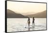 Paddleboarding on Whitefish Lake at Sunset in Whitefish, Montana, USA-Chuck Haney-Framed Stretched Canvas