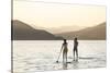 Paddleboarding on Whitefish Lake at Sunset in Whitefish, Montana, USA-Chuck Haney-Stretched Canvas