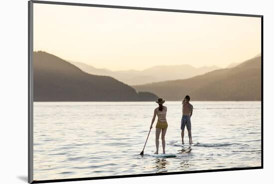 Paddleboarding on Whitefish Lake at Sunset in Whitefish, Montana, USA-Chuck Haney-Mounted Photographic Print