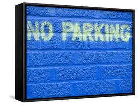 Painted Blue Brick Wall with No Parking Sign-John Nordell-Framed Stretched Canvas