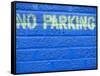 Painted Blue Brick Wall with No Parking Sign-John Nordell-Framed Stretched Canvas