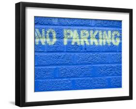 Painted Blue Brick Wall with No Parking Sign-John Nordell-Framed Premium Photographic Print